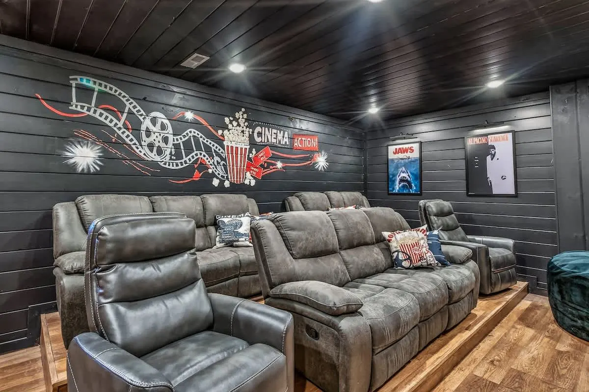 Cinema-mural wall and reclining theater seating at Big Star Lodge
