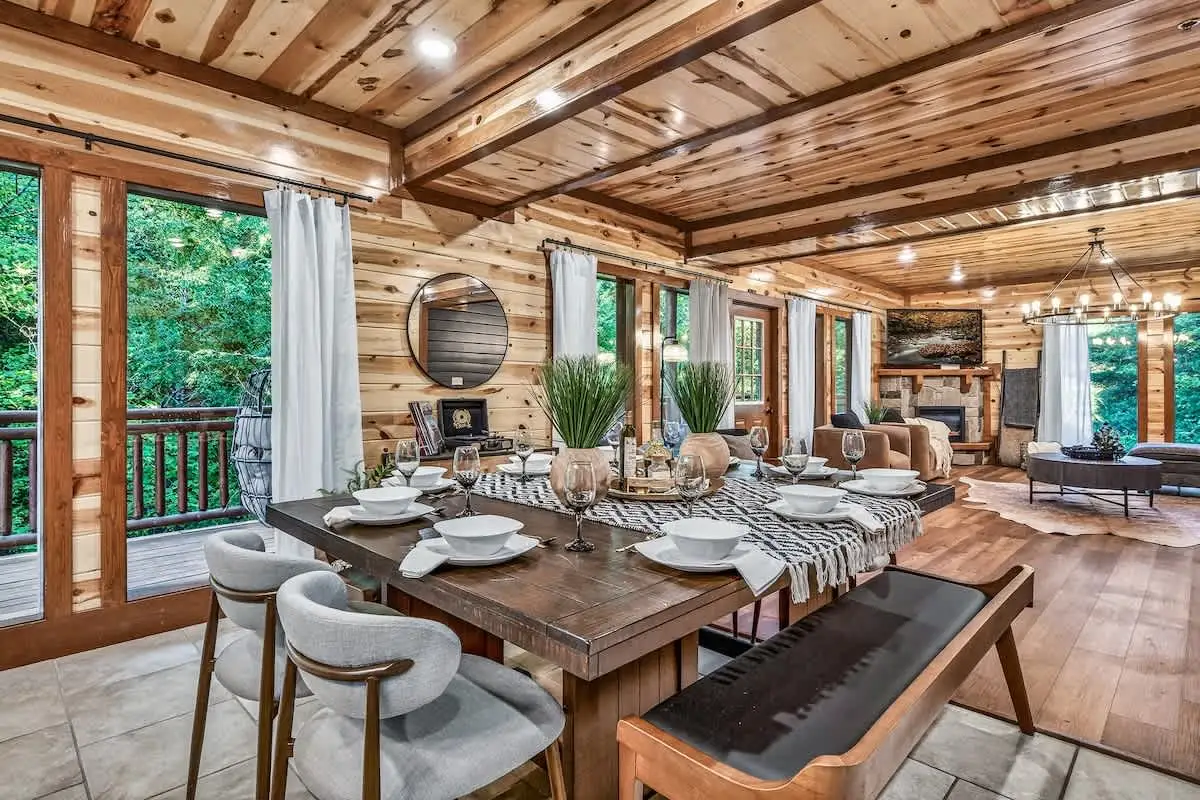 Dining area at Big Star Lodge with a long table under a vaulted wood ceiling