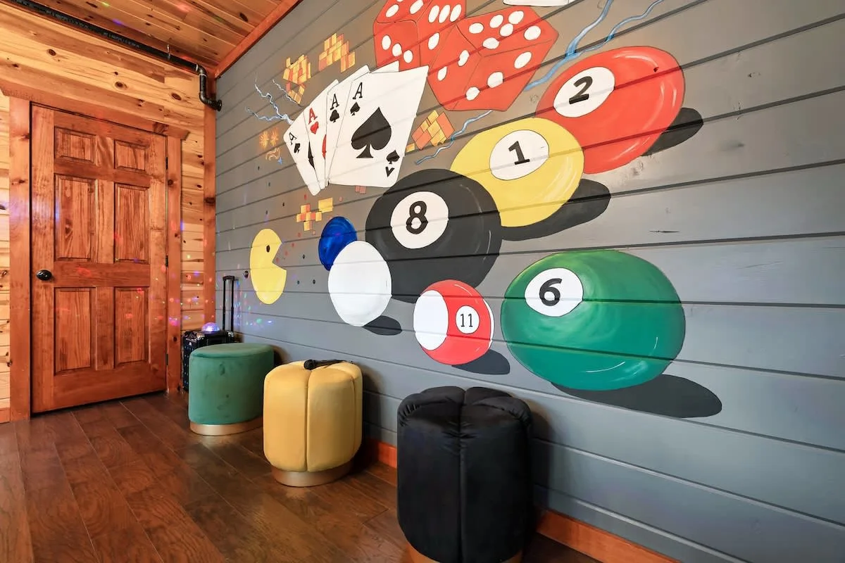 Billiards and card mural along the lower-level hallway at Blackhawk Lodge