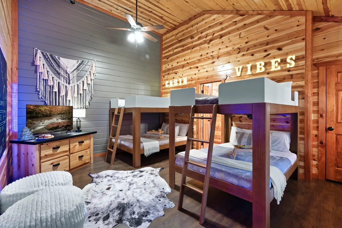 Second bunk room at Blackhawk Lodge with four bunks and a dresser
