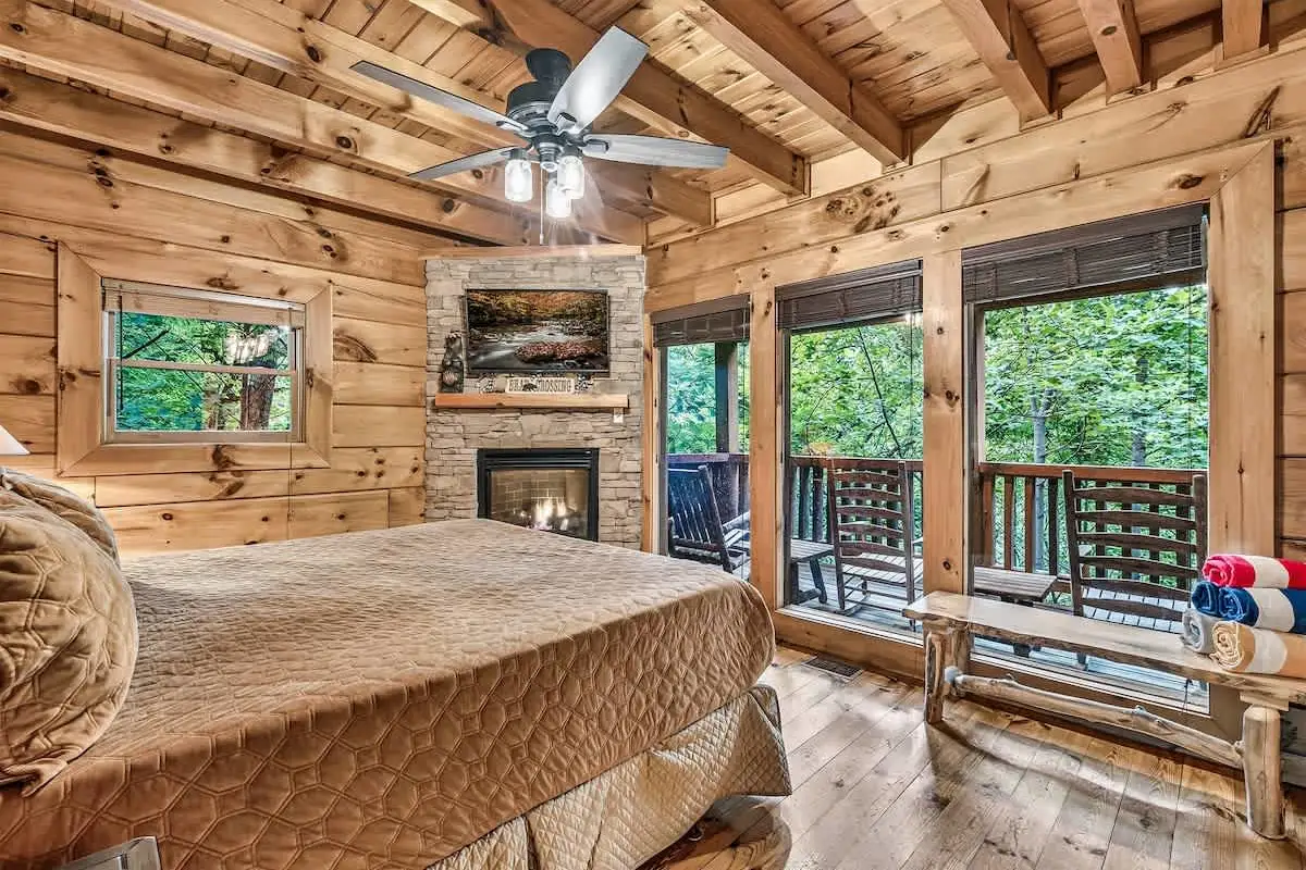 King suite at Break Point Lodge with its own stone fireplace and deck access