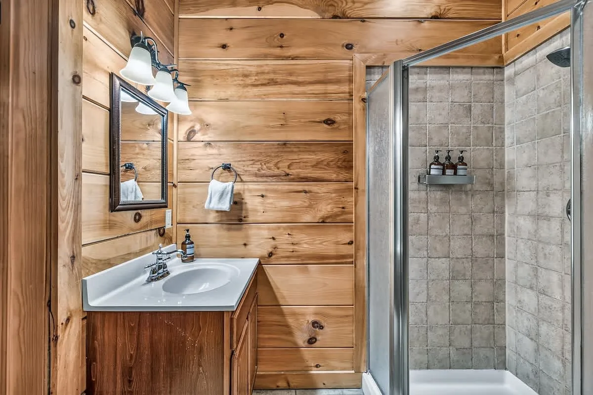 En-suite bathroom at Break Point Lodge with a tiled walk-in shower