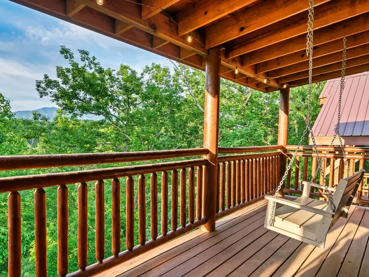 Covered deck with porch swing and mountain view