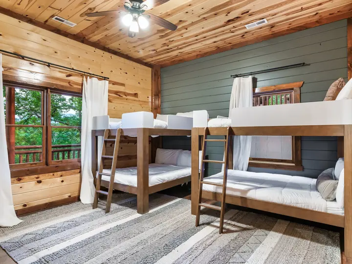 Bunk room with two sets of bunk beds