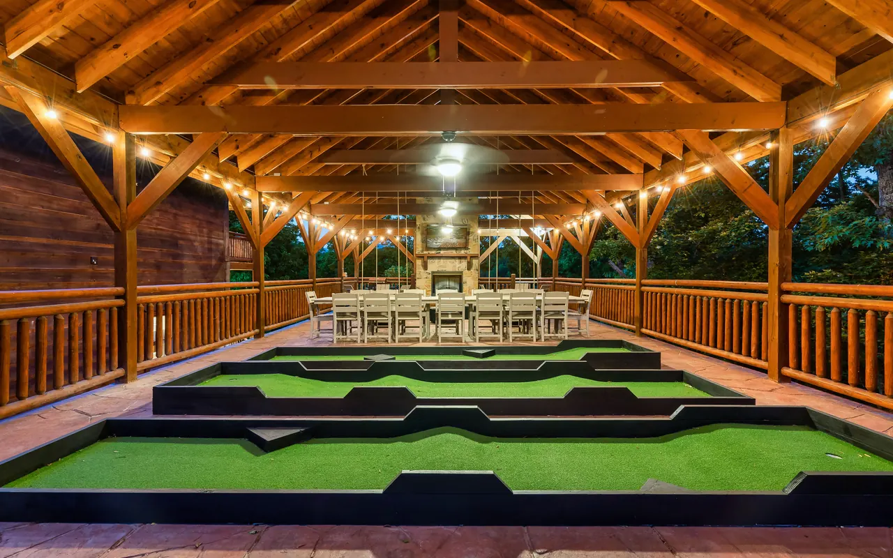 Covered pavilion with putting course and outdoor fireplace
