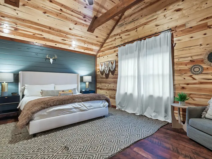 King bedroom with upholstered headboard