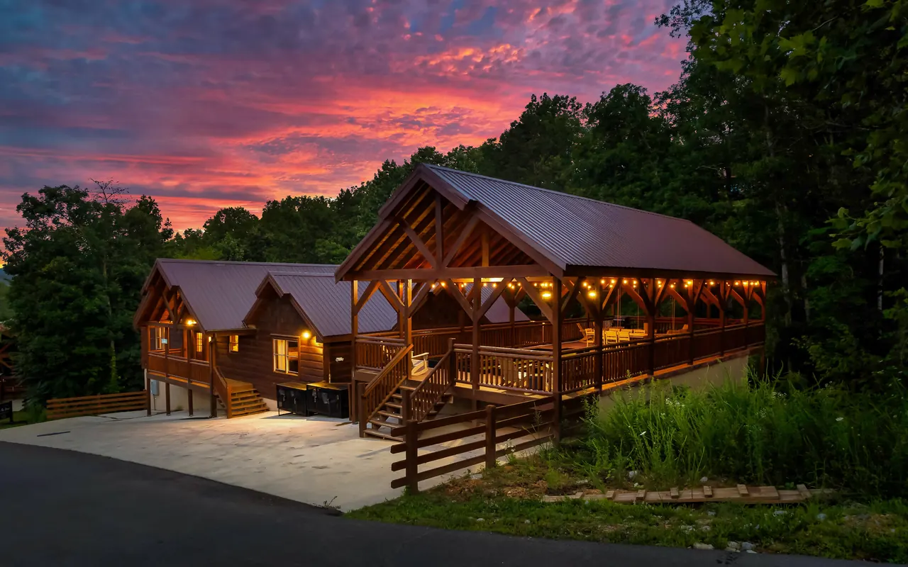 Big Foot Lodge and its covered pavilion under a sunset sky