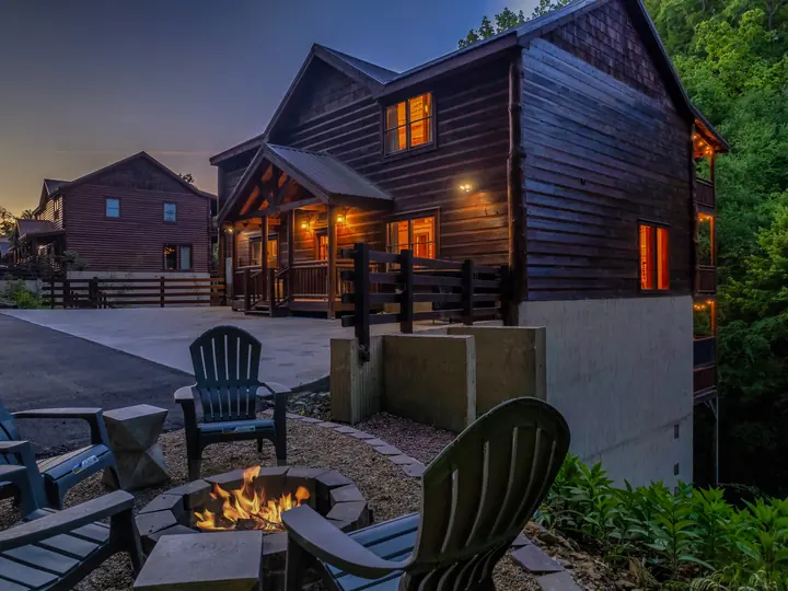 Fire pit and chairs beside the cabin