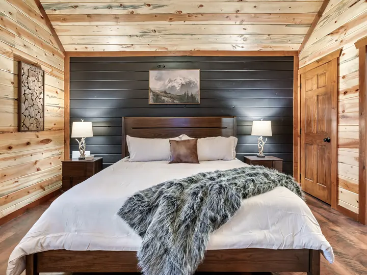King bedroom with dark accent wall