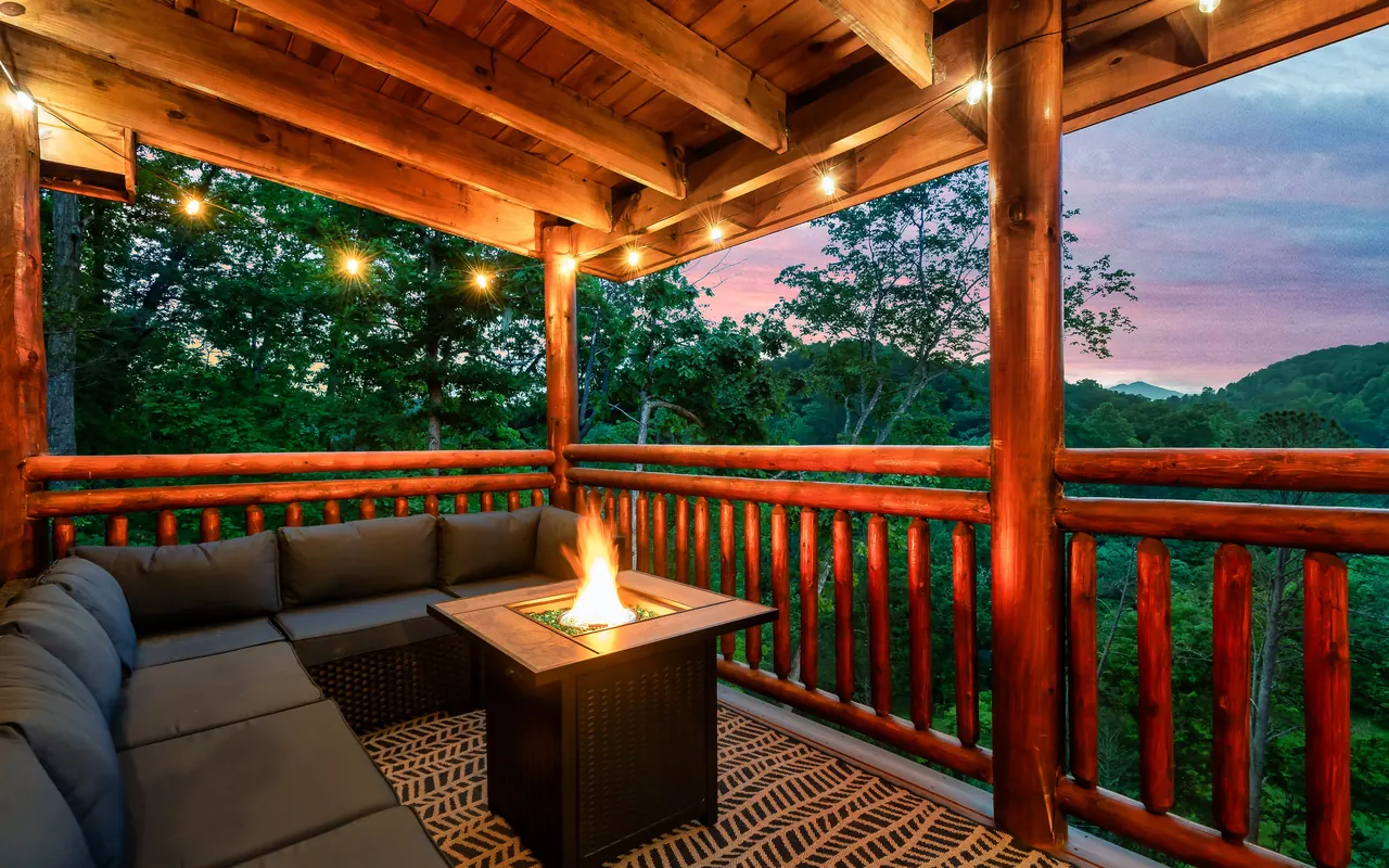 Covered deck with fire table at sunset