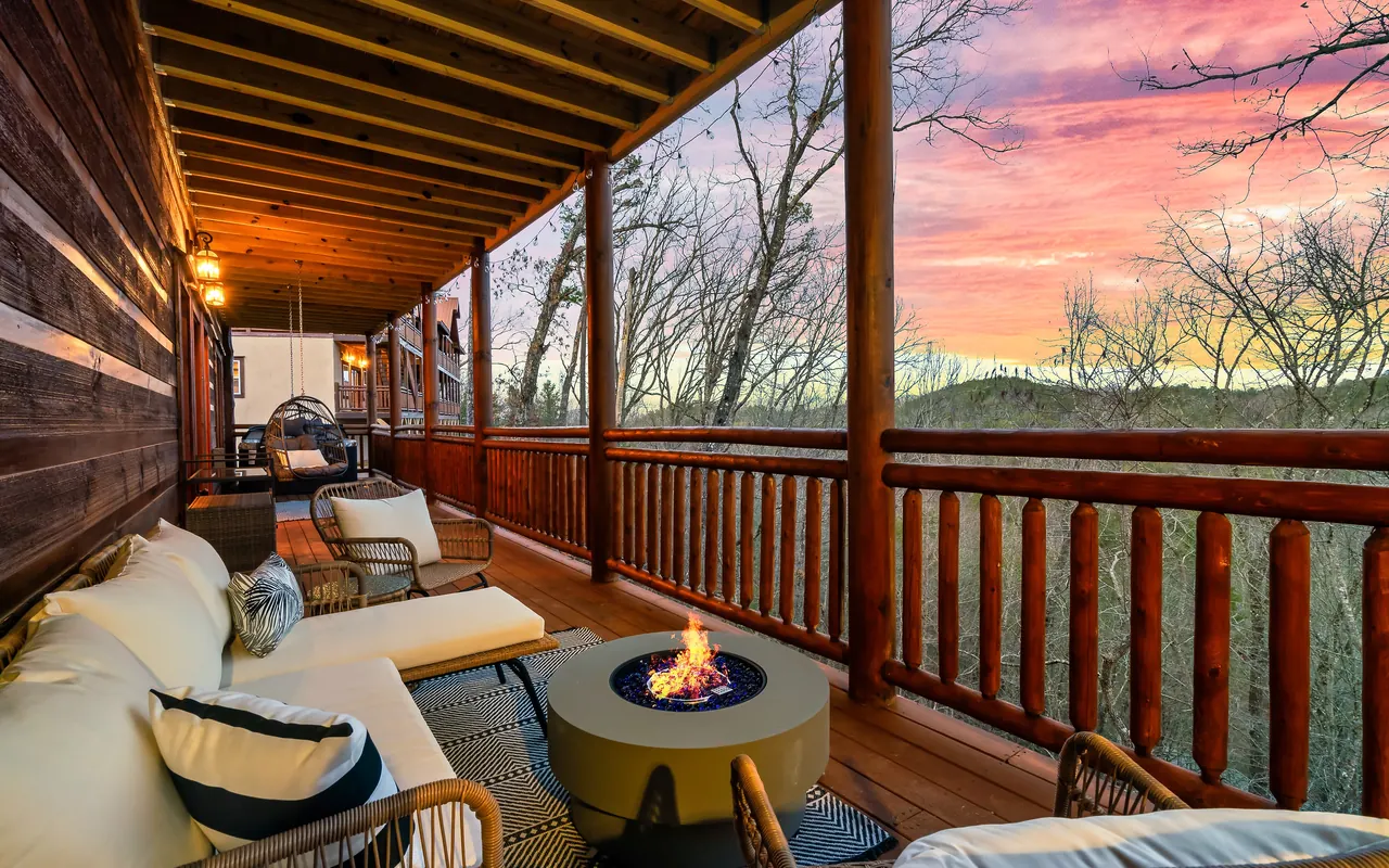 Covered deck with fire table at sunset