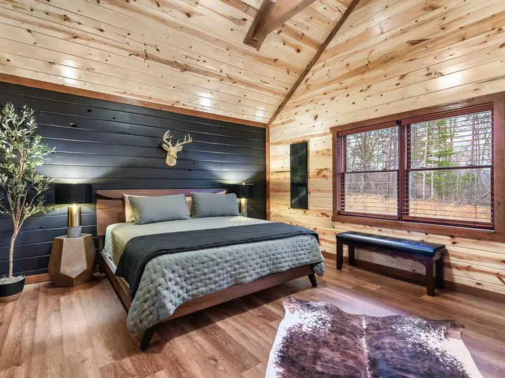 King bedroom with knotty pine walls
