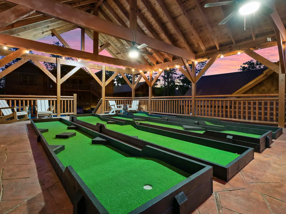 Putting course under a pavilion at sunset