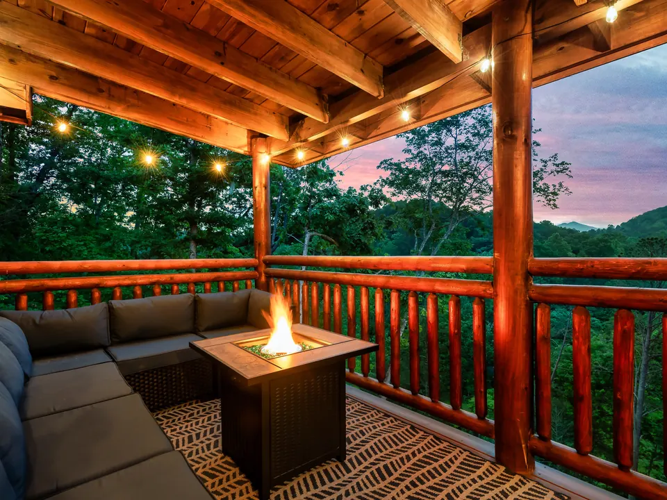 Covered deck with fire table at sunset